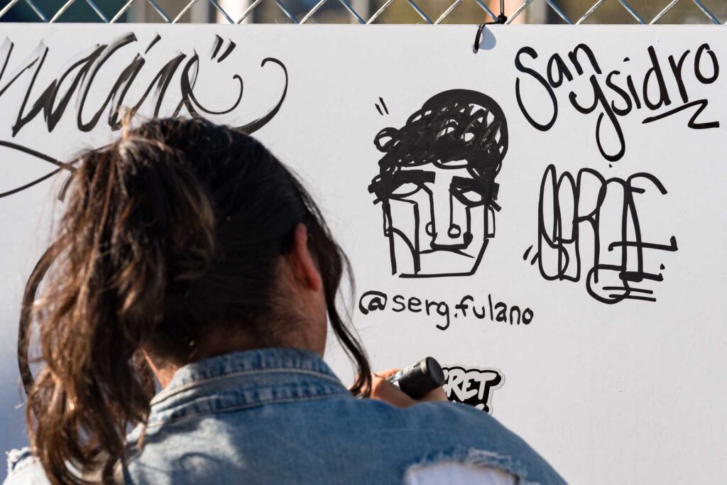 a person drawing on a white board
