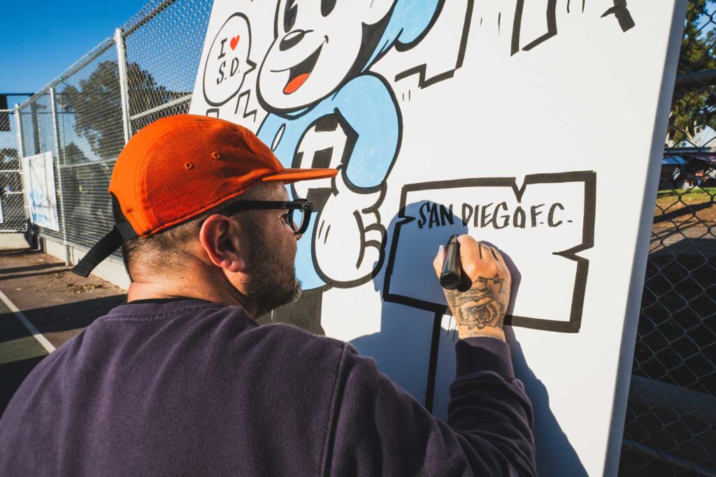 a person drawing on a white board 