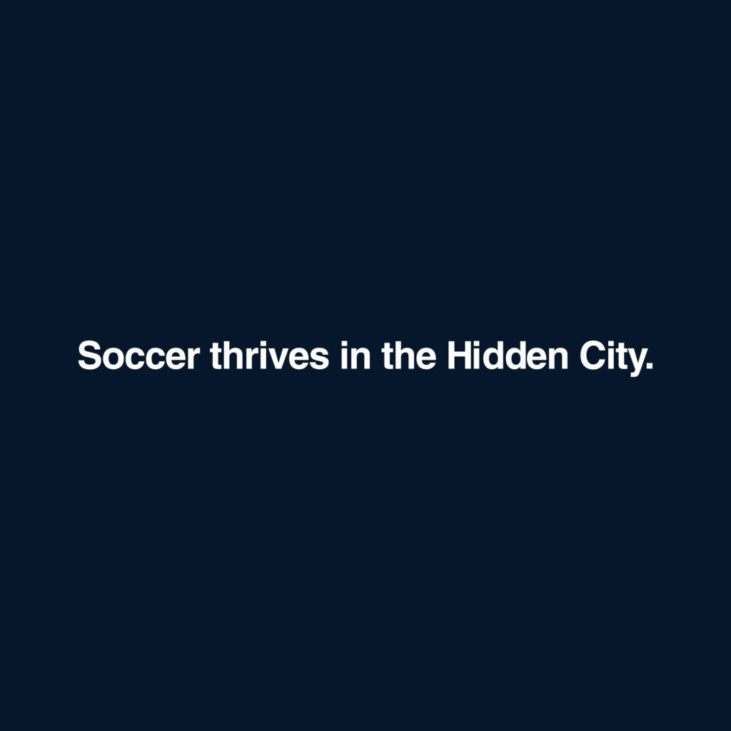 blue background and white text that reads "Soccer thrives in the Hidden City"
