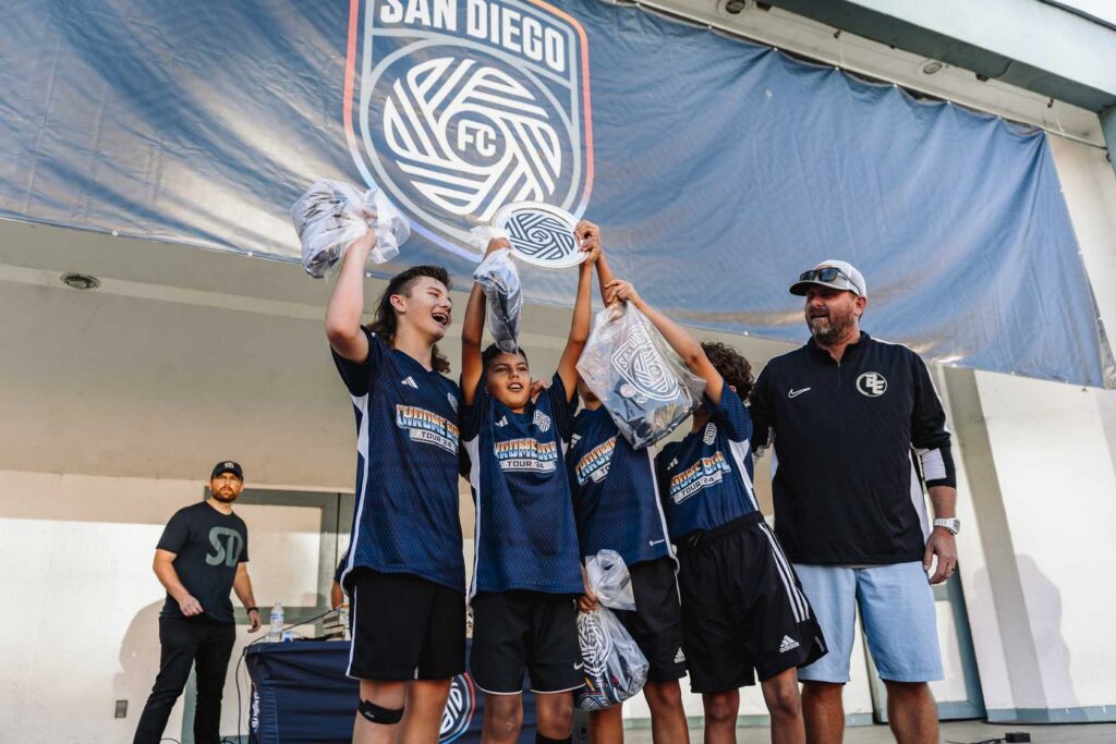 group of boys holding up a trophy