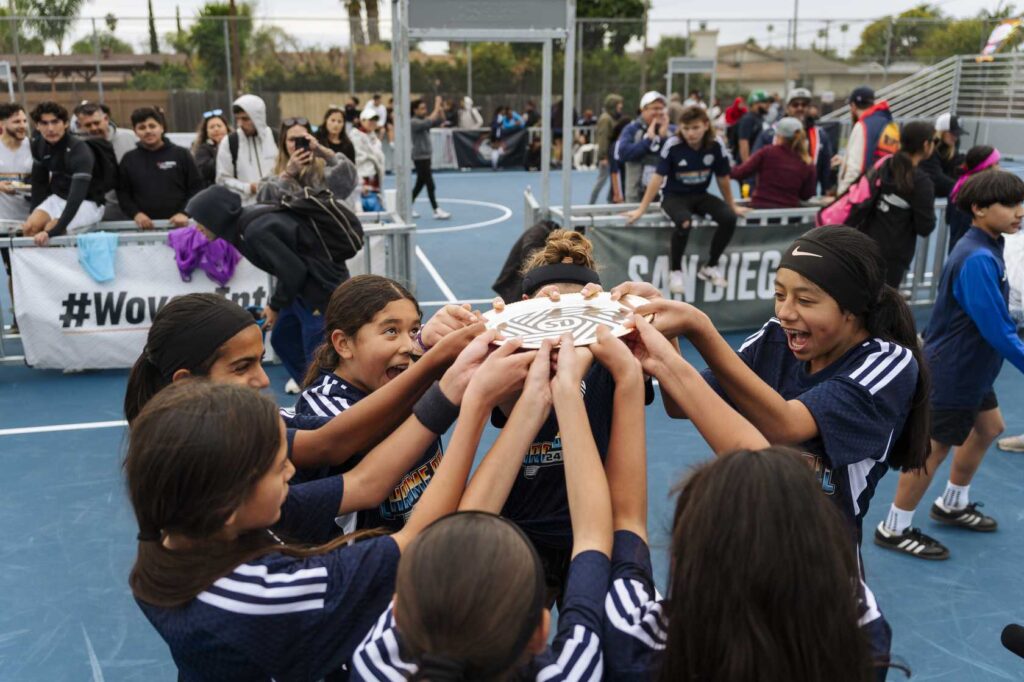 group of children holding a trophy